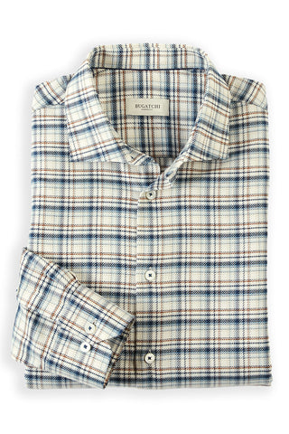 A neatly folded long-sleeve plaid button-up shirt by Bogatchi, featuring a cream base with blue and brown check lines, set against a plain white background.